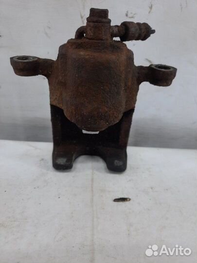 Суппорт тормозной задний левый Nissan X-Trail